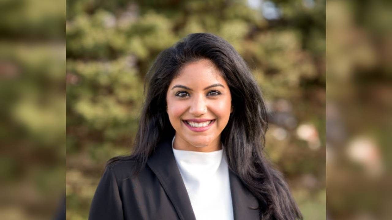 Chaya Nayak, former Meta AI architect, smiling in professional attire outdoors.